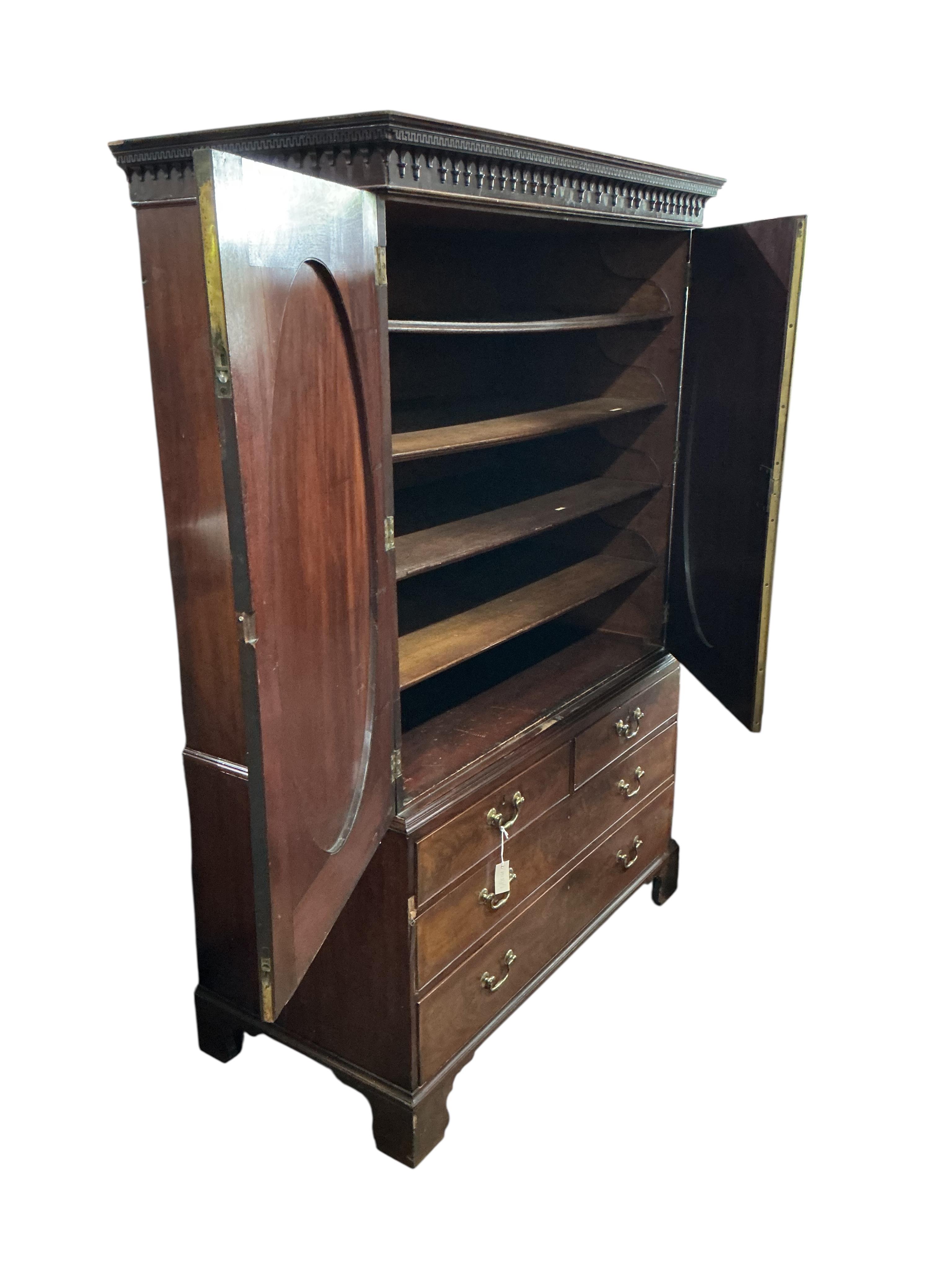 A George III banded mahogany linen press, width 128cm, depth 65cm, height 196cm